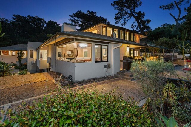 1859 Zapo St, Del Mar, CA 92014 - view of front of house featuring stucco siding and a chimney