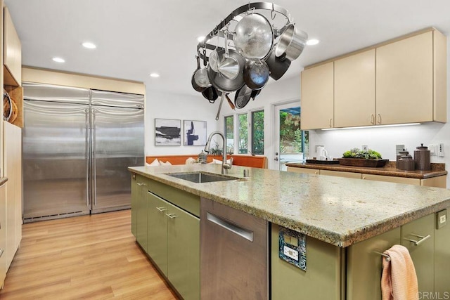 1859 Zapo St, Del Mar, CA 92014 - kitchen featuring stainless steel built in fridge, light wood-style flooring, recessed lighting, a kitchen island with sink, and light stone countertops