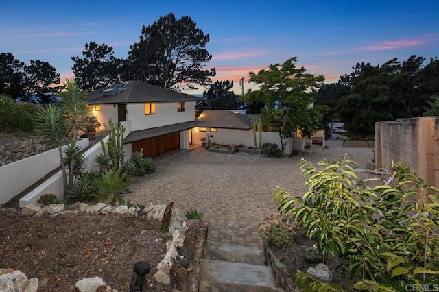 1859 Zapo St, Del Mar, CA 92014 - view of front of home featuring a garage, driveway, and solar panels