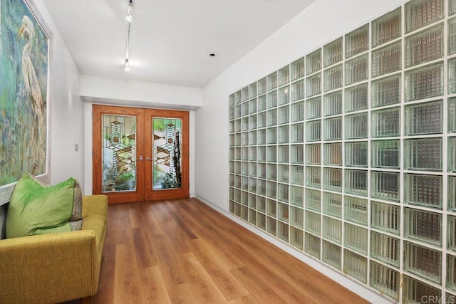 1859 Zapo St, Del Mar, CA 92014 - entrance foyer featuring french doors, rail lighting, and wood finished floors