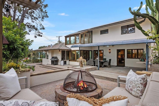 1859 Zapo St, Del Mar, CA 92014 - back of property with stucco siding, a patio, an outdoor living space with a fire pit, and area for grilling