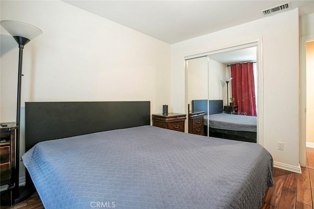 7129 Forbes Ave, Van Nuys, CA 91406 - bedroom featuring dark wood-style floors, baseboards, and a closet