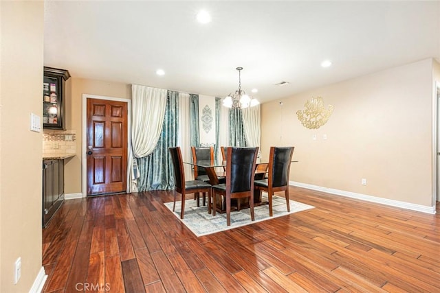 7129 Forbes Ave, Van Nuys, CA 91406 - dining room with a chandelier, hardwood / wood-style flooring, baseboards, and recessed lighting