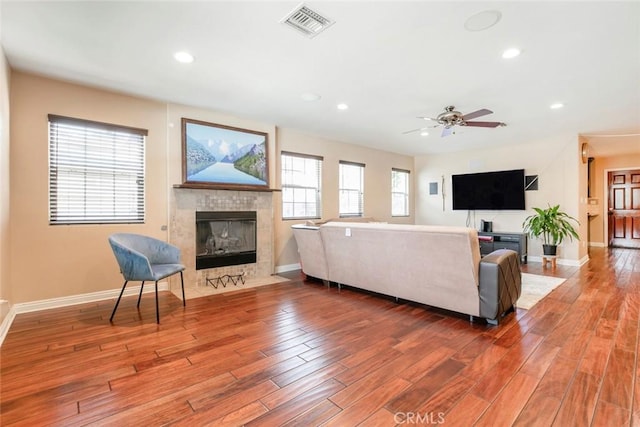 7129 Forbes Ave, Van Nuys, CA 91406 - living room featuring a fireplace, wood finished floors, recessed lighting, baseboards, and a ceiling fan