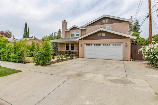 7129 Forbes Ave, Van Nuys, CA 91406 - traditional-style home featuring concrete driveway, stucco siding, a chimney, an attached garage, and stone siding
