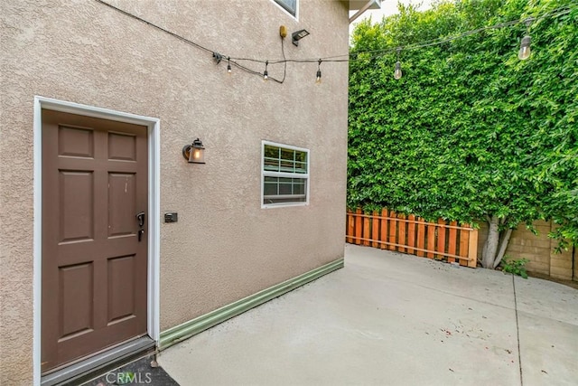 7129 Forbes Ave, Van Nuys, CA 91406 - property entrance with stucco siding and a patio