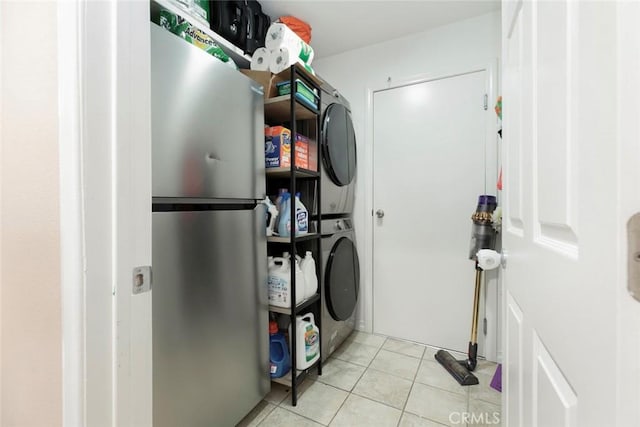 7129 Forbes Ave, Van Nuys, CA 91406 - washroom with estacked washer and dryer and light tile patterned flooring