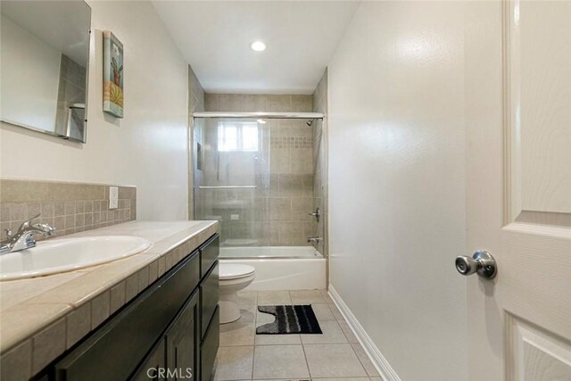 7129 Forbes Ave, Van Nuys, CA 91406 - full bathroom featuring toilet, vanity, tile patterned flooring, washtub / shower combination, and baseboards