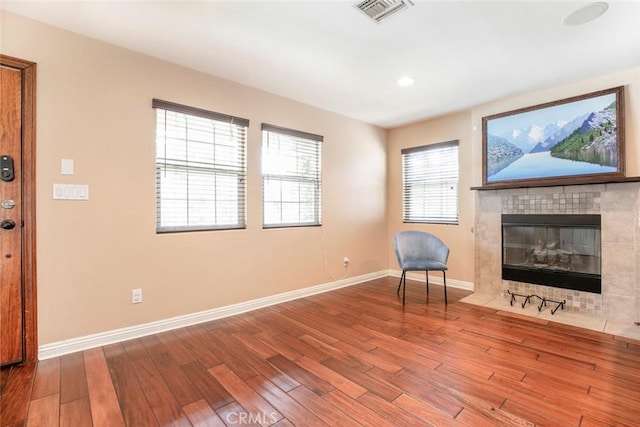 7129 Forbes Ave, Van Nuys, CA 91406 - living area with wood finished floors, baseboards, a fireplace, and recessed lighting