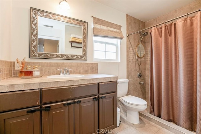 7129 Forbes Ave, Van Nuys, CA 91406 - bathroom with toilet, vanity, tile patterned flooring, a tile shower, and backsplash
