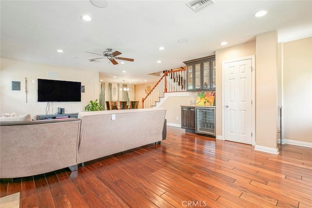 7129 Forbes Ave, Van Nuys, CA 91406 - living room with a bar, wood finished floors, ceiling fan, recessed lighting, and stairway