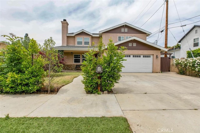 7129 Forbes Ave, Van Nuys, CA 91406 - traditional-style house featuring stucco siding, a chimney, concrete driveway, and a garage