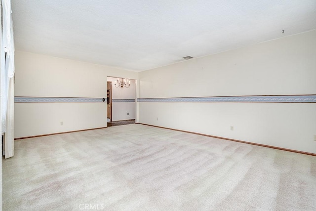 41202 Collegian Way, Hemet, CA 92544 - carpeted spare room with a chandelier and baseboards