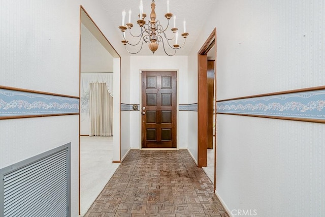 41202 Collegian Way, Hemet, CA 92544 - hallway featuring a chandelier, baseboards, and wallpapered walls