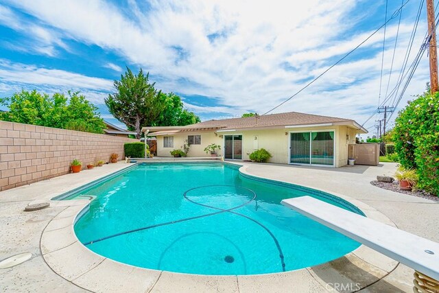 41202 Collegian Way, Hemet, CA 92544 - view of swimming pool with a diving board, a patio area, and a fenced backyard