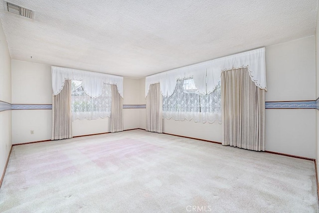 41202 Collegian Way, Hemet, CA 92544 - spare room with healthy amount of natural light, carpet flooring, and a textured ceiling