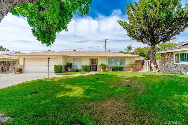41202 Collegian Way, Hemet, CA 92544 - ranch-style home featuring a garage, driveway, and stucco siding