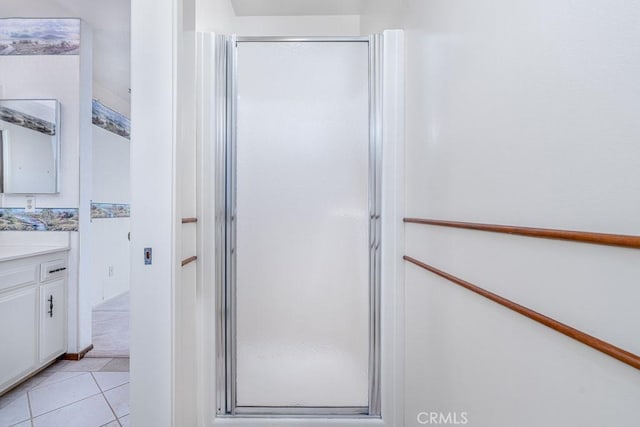 41202 Collegian Way, Hemet, CA 92544 - bathroom with vanity, a shower stall, and tile patterned flooring
