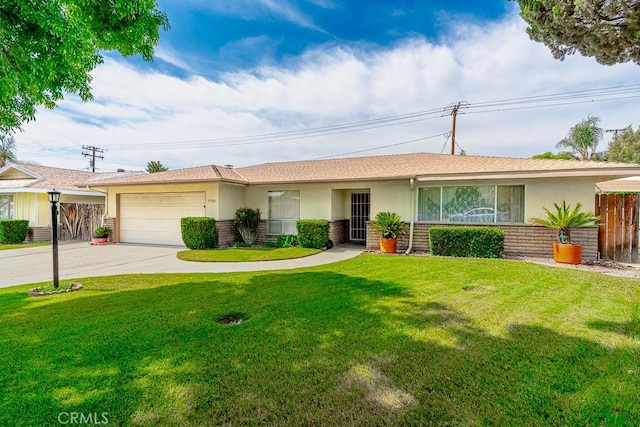 41202 Collegian Way, Hemet, CA 92544 - ranch-style house with stucco siding, an attached garage, and driveway