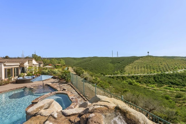 14220 Green Valley Ct, Scripps Miramar, CA 92131 - view of swimming pool with an outdoor hangout area, a fenced backyard, a pool with connected hot tub, and a patio area
