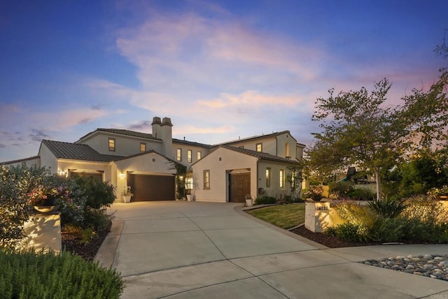 14220 Green Valley Ct, Scripps Miramar, CA 92131 - mediterranean / spanish-style house with an attached garage, concrete driveway, stucco siding, a chimney, and a tiled roof