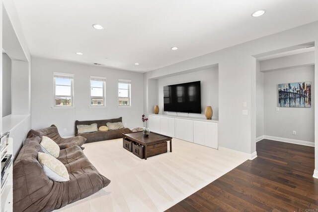14220 Green Valley Ct, Scripps Miramar, CA 92131 - living room featuring dark wood-style floors, baseboards, and recessed lighting