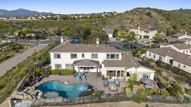14220 Green Valley Ct, Scripps Miramar, CA 92131 - aerial perspective of suburban area featuring a mountainous background and a pool