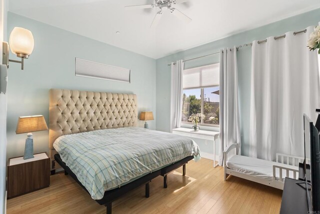 14220 Green Valley Ct, Scripps Miramar, CA 92131 - bedroom with light wood-type flooring and a ceiling fan
