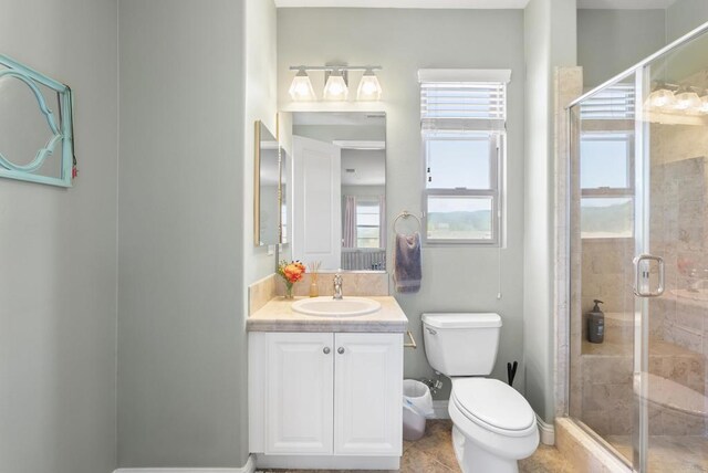 14220 Green Valley Ct, Scripps Miramar, CA 92131 - full bathroom featuring toilet, vanity, a shower stall, and baseboards