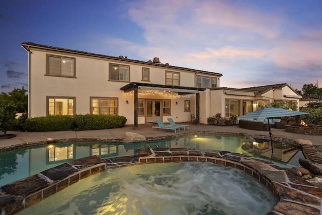 14220 Green Valley Ct, Scripps Miramar, CA 92131 - back of house featuring a pool with connected hot tub, stucco siding, and a patio area