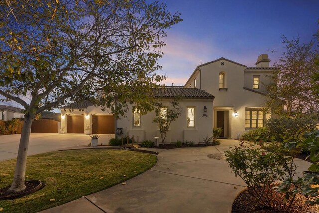 14220 Green Valley Ct, Scripps Miramar, CA 92131 - mediterranean / spanish-style home with concrete driveway, a tile roof, stucco siding, a front yard, and a chimney