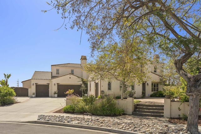 14220 Green Valley Ct, Scripps Miramar, CA 92131 - mediterranean / spanish home featuring a garage, a fenced front yard, driveway, and a chimney