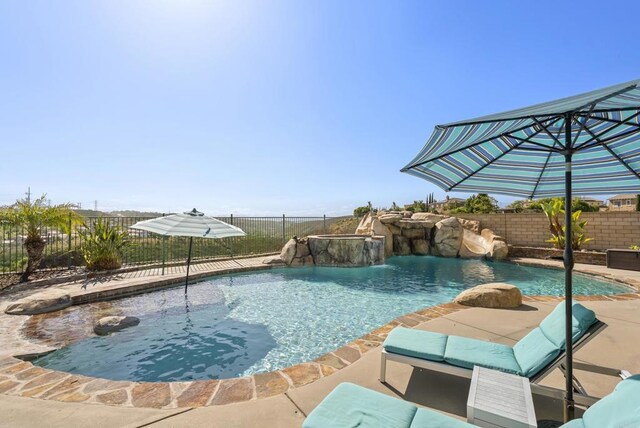 14220 Green Valley Ct, Scripps Miramar, CA 92131 - view of pool featuring a fenced backyard and a patio