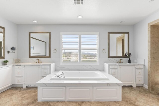 14220 Green Valley Ct, Scripps Miramar, CA 92131 - full bathroom with a garden tub, two vanities, recessed lighting, and tile patterned flooring