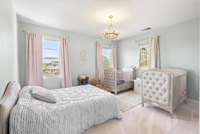 14220 Green Valley Ct, Scripps Miramar, CA 92131 - bedroom with a chandelier and baseboards