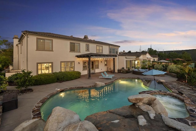 14220 Green Valley Ct, Scripps Miramar, CA 92131 - back of house featuring a patio area, stucco siding, and a pool with connected hot tub