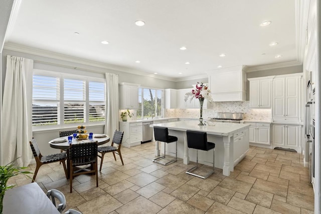 14220 Green Valley Ct, Scripps Miramar, CA 92131 - kitchen featuring dishwasher, a center island, decorative backsplash, a kitchen bar, and recessed lighting