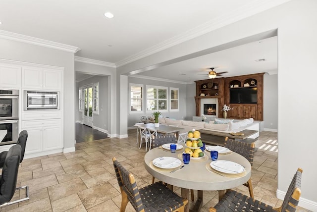 14220 Green Valley Ct, Scripps Miramar, CA 92131 - dining room with stone tile flooring, baseboards, ornamental molding, ceiling fan, and recessed lighting