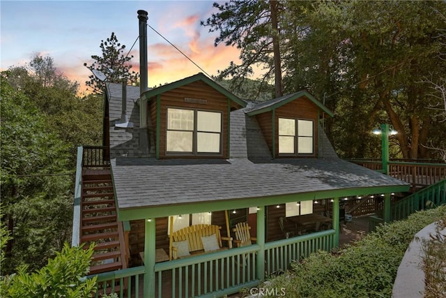 379 Dorn Dr, Crestline, CA 92325 - view of front facade featuring stairs and a shingled roof