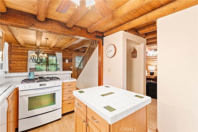 379 Dorn Dr, Crestline, CA 92325 - kitchen featuring white gas stove, tile countertops, wood ceiling with exposed beams, rustic walls, and a chandelier
