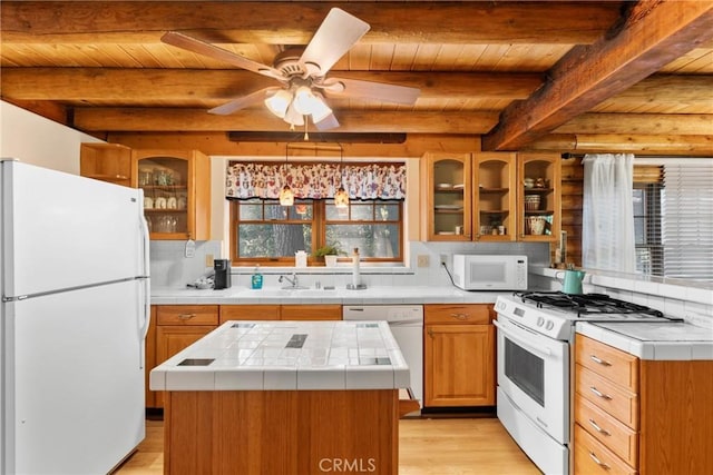379 Dorn Dr, Crestline, CA 92325 - kitchen featuring white appliances, tile countertops, wooden ceiling with exposed beams, a sink, and light wood finished floors