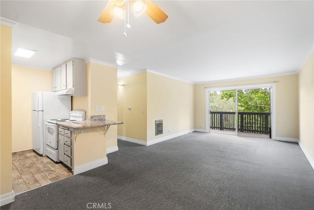 3603 W Hidden Ln Unit 317, Rolling Hills Estates, CA 90274 - kitchen with white appliances, crown molding, a ceiling fan, baseboards, and under cabinet range hood