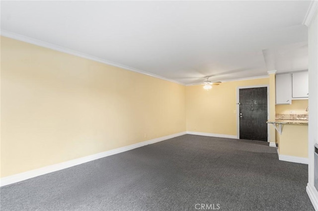 3603 W Hidden Ln Unit 317, Rolling Hills Estates, CA 90274 - unfurnished living room featuring ornamental molding, baseboards, a ceiling fan, and dark carpet
