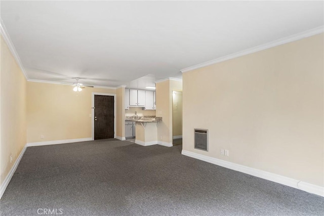 3603 W Hidden Ln Unit 317, Rolling Hills Estates, CA 90274 - unfurnished living room featuring heating unit, crown molding, baseboards, dark carpet, and ceiling fan