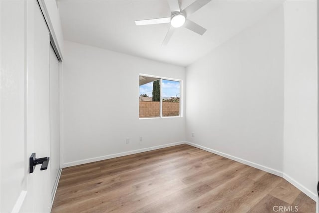 37109 Daisy St, Palmdale, CA 93550 - unfurnished bedroom with light wood finished floors, a closet, lofted ceiling, baseboards, and ceiling fan