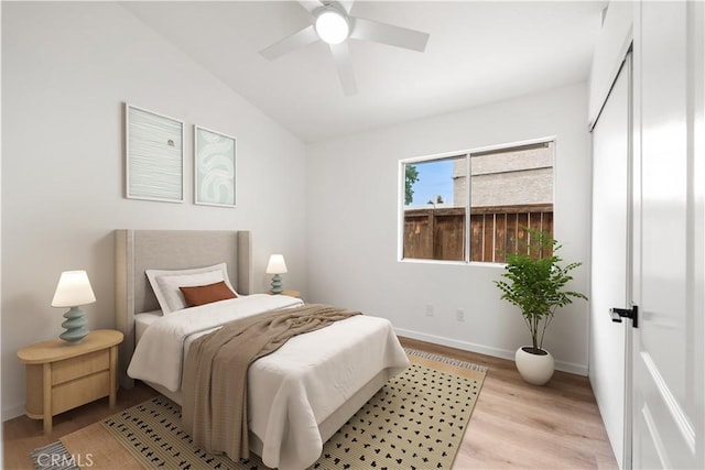 37109 Daisy St, Palmdale, CA 93550 - bedroom with light wood-style flooring, vaulted ceiling, baseboards, and a ceiling fan