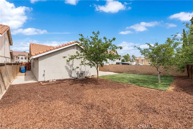 37109 Daisy St, Palmdale, CA 93550 - view of yard with central air condition unit and a patio