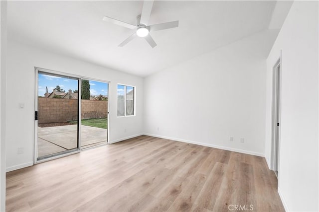 37109 Daisy St, Palmdale, CA 93550 - spare room featuring light wood-type flooring, baseboards, a ceiling fan, and vaulted ceiling