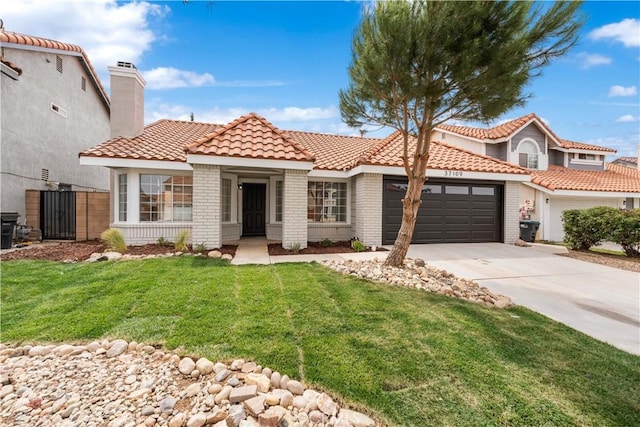 37109 Daisy St, Palmdale, CA 93550 - mediterranean / spanish-style house featuring an attached garage, driveway, a tiled roof, a chimney, and brick siding