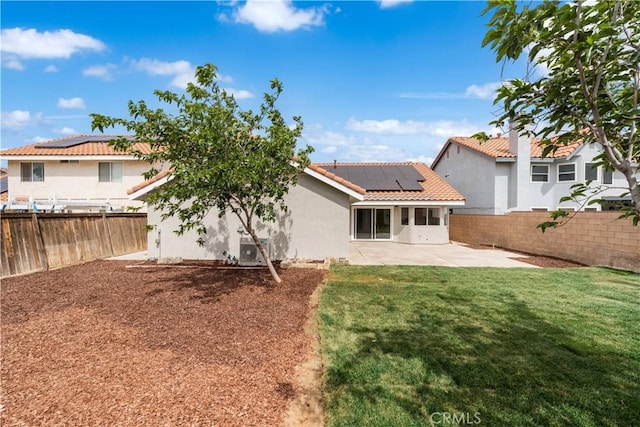 37109 Daisy St, Palmdale, CA 93550 - rear view of property with a tile roof, a patio, solar panels, and stucco siding